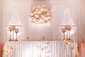 festive wedding table decoration with crystal chandeliers, golden candlesticks, candles and white pink flowers . stylish Royalty Free Stock Photo