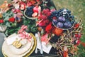 The festive wedding table with red autumn leaves. Wedding decoration. Artwork Royalty Free Stock Photo