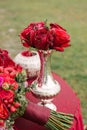 Festive wedding table setting, red roses in a silver vase Royalty Free Stock Photo