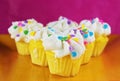 Festive white cupcakes on a plate