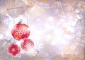 Festive winter background with red holiday balls against bokeh lights and frame of hoarfrost leaves Royalty Free Stock Photo