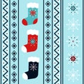 Festive winter holidays vertical seamless pattern with christmas stockings and snowflakes