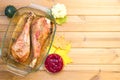 Festive wooden table with baked turkey drumsticks