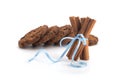 Festive wrapped cinnamon sticks isolated on white background Royalty Free Stock Photo