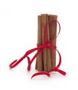 Festive wrapped cinnamon sticks isolated on white background Royalty Free Stock Photo