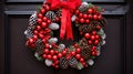 A festive wreath made up of pine cones and holly berries,