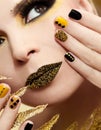 Festive yellow black manicure and makeup . Royalty Free Stock Photo