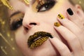 Festive yellow black manicure and makeup . Royalty Free Stock Photo