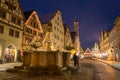 Festively decorated fountain near the Christmas market in Rothenburg ob der Tauber, Germany