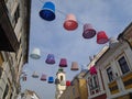 Festively decorated street of the old city. Large beautiful multi-colored lampshades hang over the heads of tourists Royalty Free Stock Photo