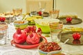 Festively decorated table for Rosh Ashanah, with pomegranates and apples