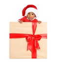 Festively dressed African-American baby in Christmas gift box