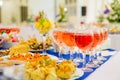 Festively laid tables at the Banquet. Various delicacies, snacks and drinks. Catering Royalty Free Stock Photo
