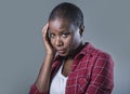 Lifestyle isolated portrait of young attractive and sad black afro American woman feeling unwell and depressed and suffering pain Royalty Free Stock Photo