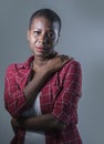 Lifestyle isolated portrait of young attractive and sad black afro American woman feeling unwell and depressed and suffering pain Royalty Free Stock Photo