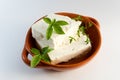 Feta cheese on brown plate