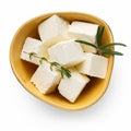 Feta cheese cubes in bowl on white Royalty Free Stock Photo