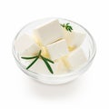 Feta cheese cubes in bowl on white Royalty Free Stock Photo