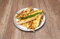 Feta Cheese Pide and vegetables on wooden table Royalty Free Stock Photo