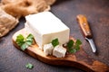 Feta cheese on rusty background