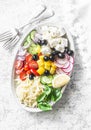Feta, orzo, tomatoes, cucumbers, radishes, olives, peppers salad on a light background, top view. Healthy food diet concept. Medit Royalty Free Stock Photo