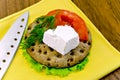 Feta piece with tomato on crispbread Royalty Free Stock Photo