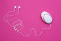 Fetal doppler with headphones for listening to the baby`s heartbeat in pregnant women, close-up, pink background, instrument