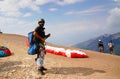 Paragliders preparing the equipment on Babadag for the launching / Ready to fly