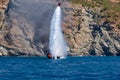 Fire on Turkish yacht in the Mediterranean Sea. Dumping water on the yacht from the sky. Oludeniz,Fethiye,Mugla,Turkey