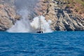 Fire on Turkish yacht in the Mediterranean Sea. White thick steam after discharge water to extinguish. Oludeniz,Fethiye,Mugla,Turk
