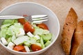 Fetta salad portion and slices of whole wheat bread