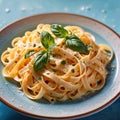 Fettuccine Alfredo pasta with cream sauce, traditional italian meal served on pastel blue plate