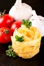 Fettuccine with few oregano strigs and vegetable