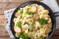 Fettuccine with fried mushrooms, cheese, broccoli and peas close Royalty Free Stock Photo