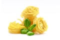 Fettuccine italian pasta with basil isolated on white background Royalty Free Stock Photo