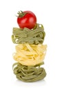 Fettuccine nest pasta with tomato cherry Royalty Free Stock Photo