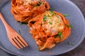 Fettuccine nests with meatball, cheese and tomato sauce