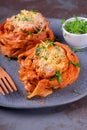 Fettuccine nests with meatball, cheese and tomato sauce