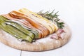 Fettuccine over white wooden background