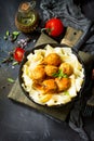 Fettuccine pasta and Homemade Beef meatballs in tomato sauce in a frying pan on dark stone table. Royalty Free Stock Photo