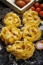 Fettuccine pasta italian food still life rustic over black wood Royalty Free Stock Photo