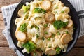 Fettuccine pasta with mushrooms king oyster, broccoli and peas c Royalty Free Stock Photo