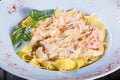 Fettuccine pasta with seafood, squid rings, shrimp, mussels, oysters, tomato, parmesan cheese Royalty Free Stock Photo