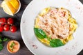 Fettuccine pasta with seafood, squid rings, shrimp, mussels, oysters, tomato, parmesan cheese Royalty Free Stock Photo