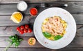 Fettuccine pasta with seafood, squid rings, shrimp, mussels, oysters, tomato, parmesan cheese Royalty Free Stock Photo