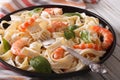 Fettuccini pasta in cream sauce with shrimp close-up. horizontal