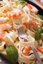 Fettuccini pasta in cream sauce with shrimp macro. Vertical Royalty Free Stock Photo