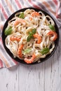 Fettuccini pasta in cream sauce with shrimp on a plate. vertical Royalty Free Stock Photo