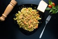 Fettuccine with cherry tomato served in a dish isolated on dark background top view of italian food Royalty Free Stock Photo