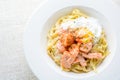 Fettucine with salmon, egg and parmesan cheese, served on white plate Royalty Free Stock Photo